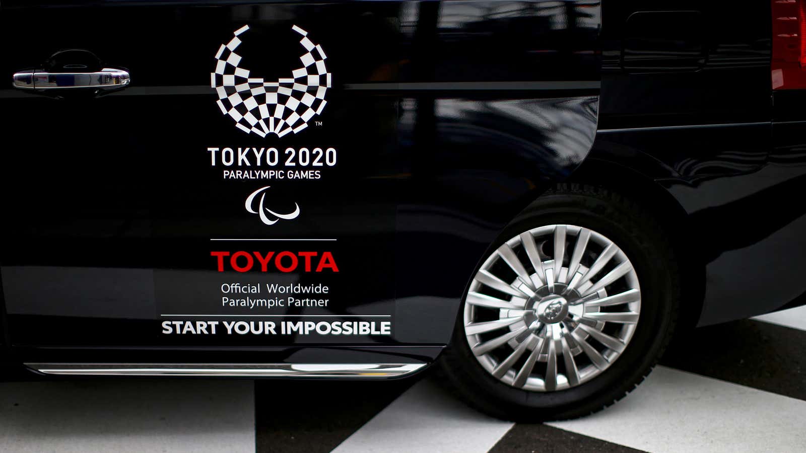 A Toyota logo, Worldwide Sponsor for Tokyo 2020 Olympic Games, is pictured on a taxi in Tokyo