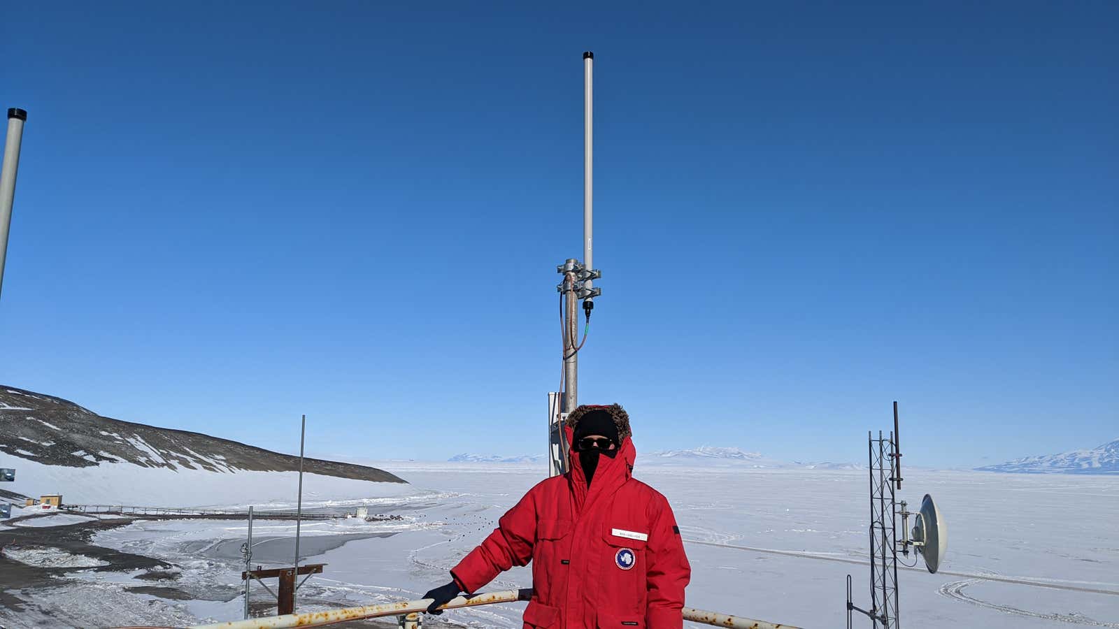 Swarm CTO Benjamin Longmier with the antennae his company installed at McMurdo Station, Antarctica.