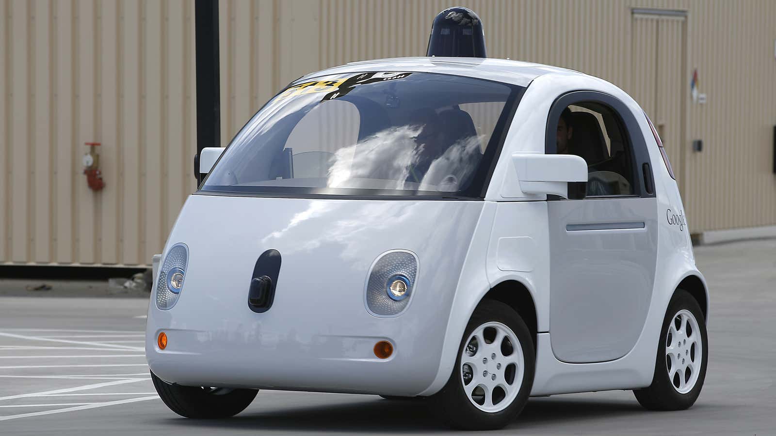 Google’s new self-driving prototype car drives around a parking lot during a demonstration at Google campus on Wednesday, May 13, 2015, in Mountain View, California.