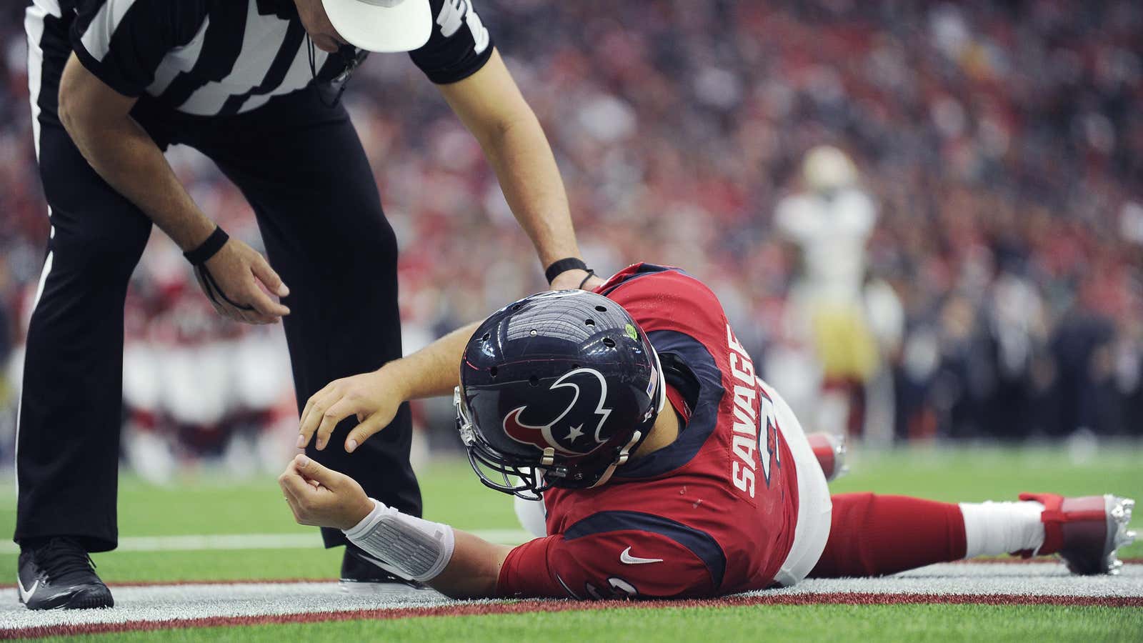 Houston Texans quarterback Tom Savage  shows a fencing response in his arms, a symptom of a concussion.