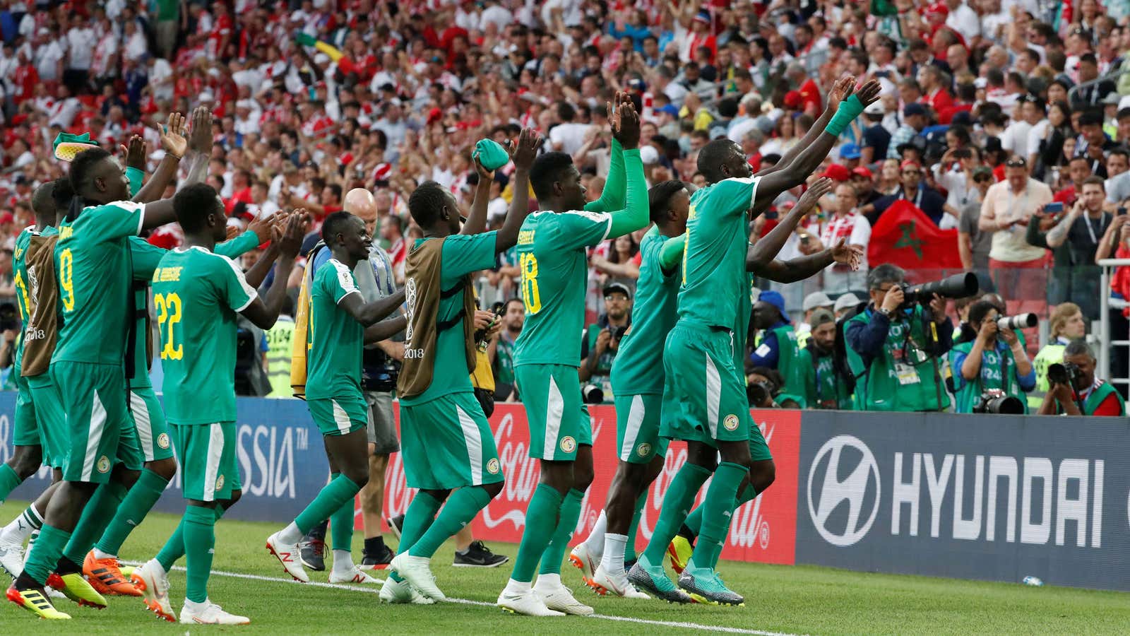 Senegal players celebrates after beating Poland