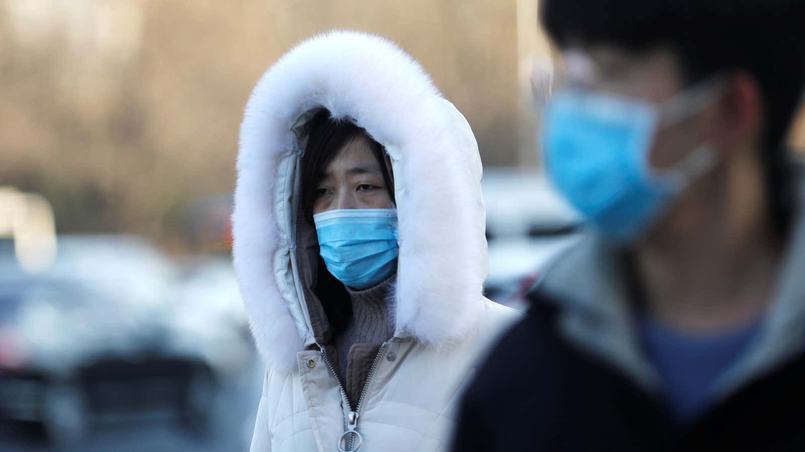 People wearing face masks walk on a street on a cold winter day, following the coronavirus disease (COVID-19) outbreak, in Beijing, China, December 21, 2020.â€¦