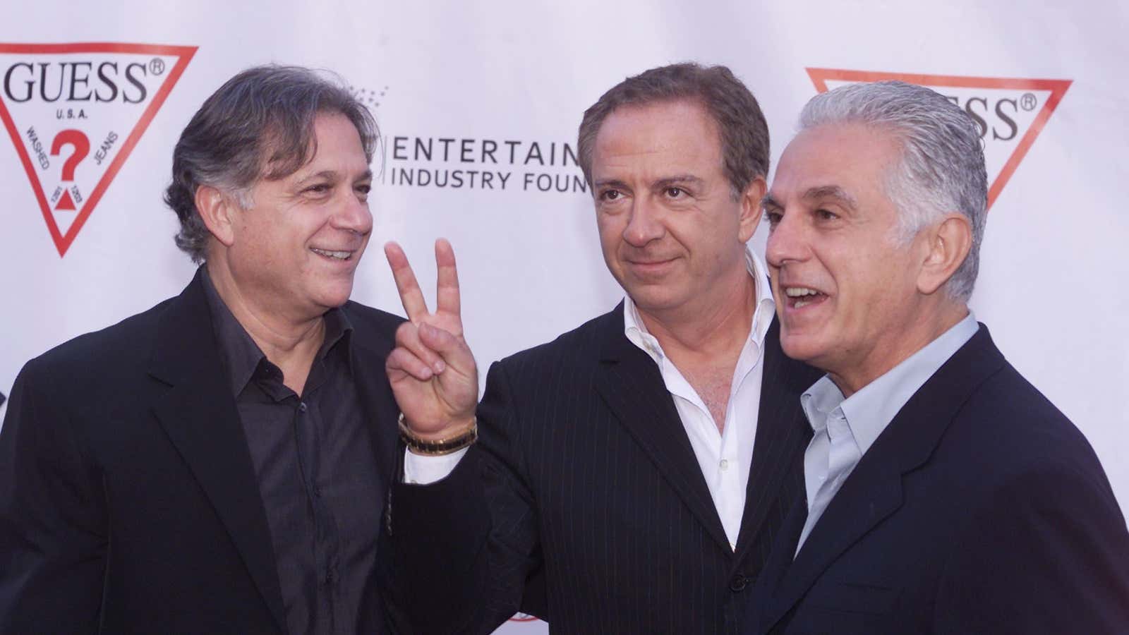 Guess? clothing line founders Armand, Paul, and Maurice Marciano in 2002.