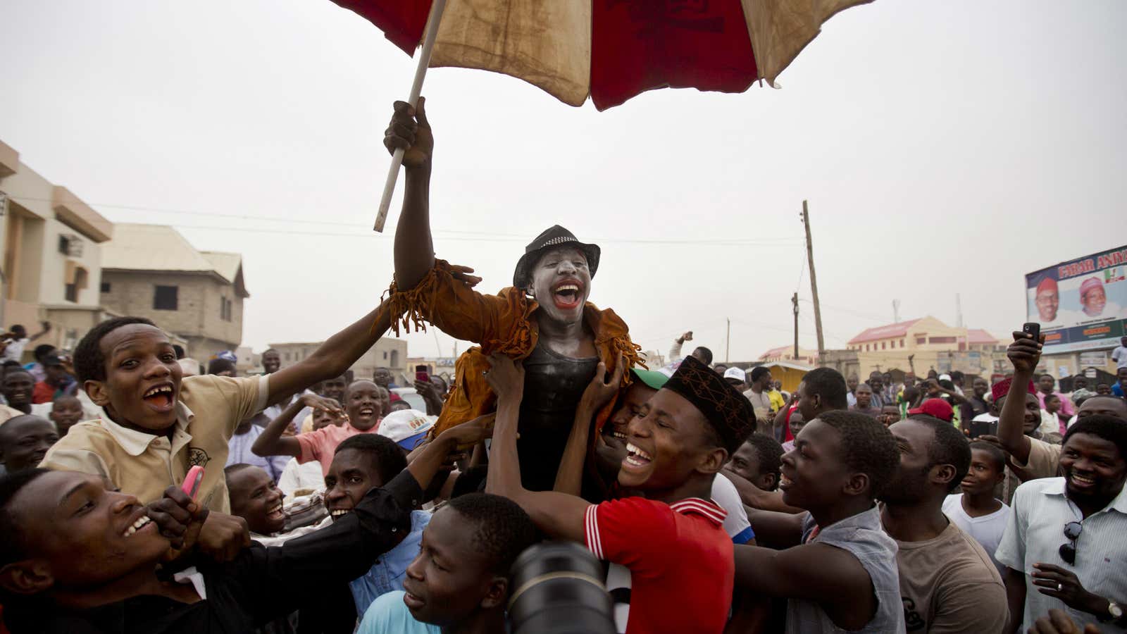 Nigerian voters celebrate the election of Muhammadu Buhari, the first time that the opposition has won power in Nigeria.