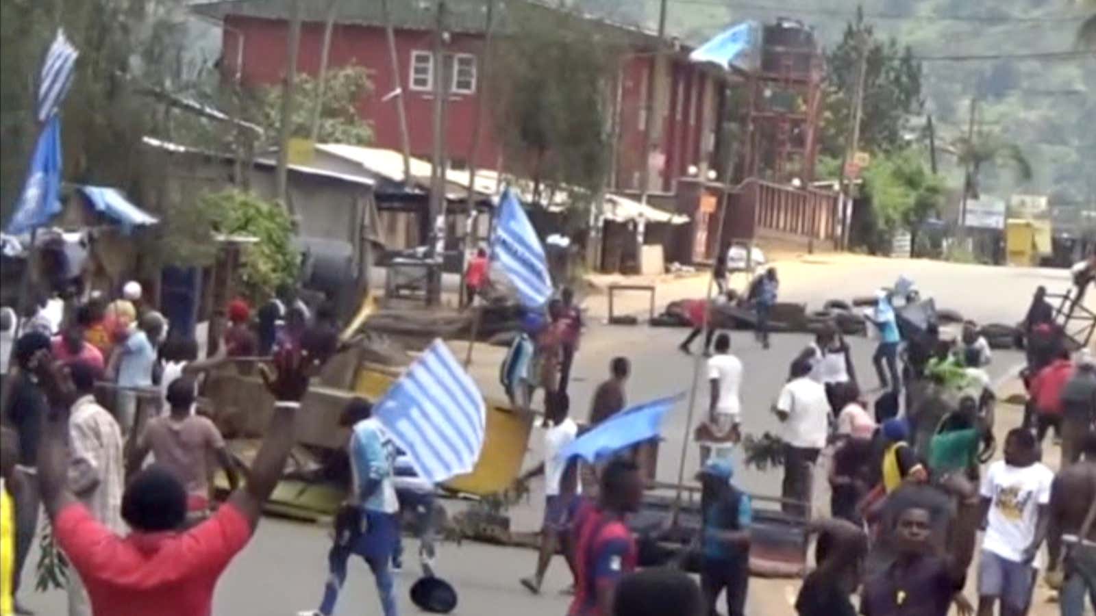 The blue and white Ambazonia flats on Oct. 1, 2017 in the English-speaking city of Bamenda, Cameroon.