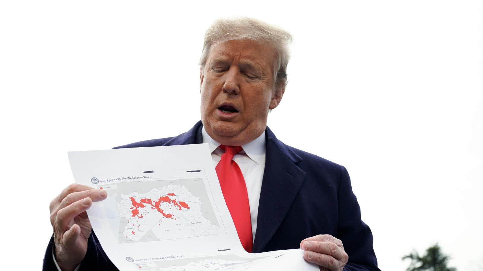 President Donald Trump shows a map of conflicts in Syria and Iraq.