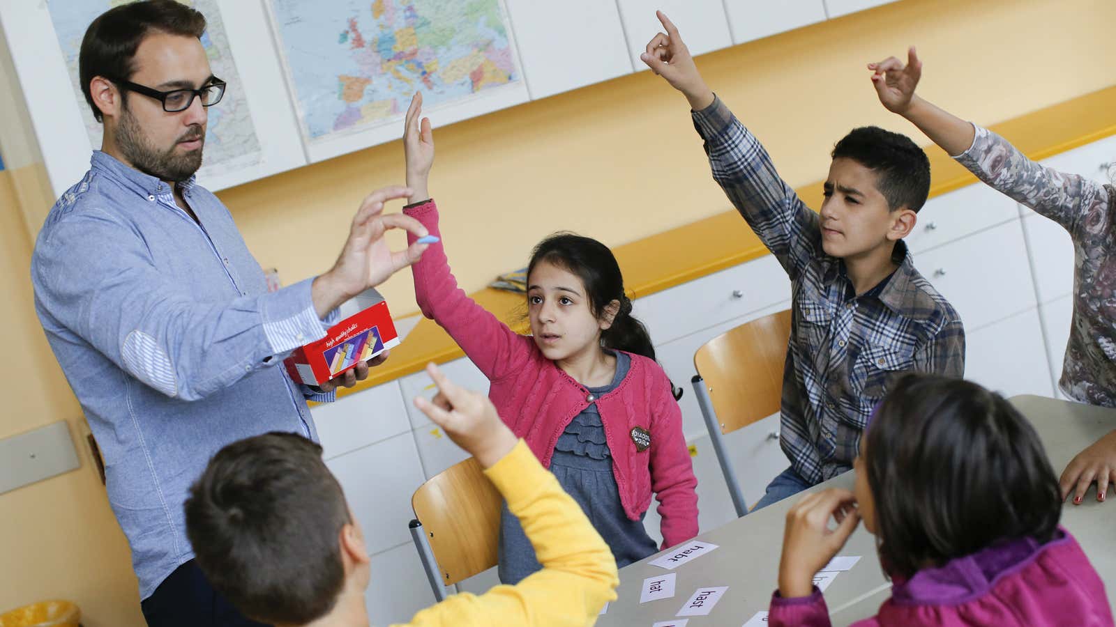DATE IMPORTED:September 11, 2015A teacher conducts a German lesson for children during a welcome class for immigrants from Syria, Poland and Romania at the Katharina-Heinroth…
