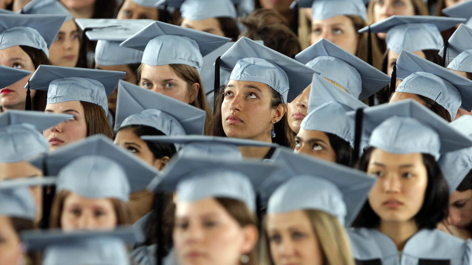 Barnard College graduates listen to President Barack Obama deliver their commencement address on the campus of Columbia University, in New York, Monday, May 14, 2012.…