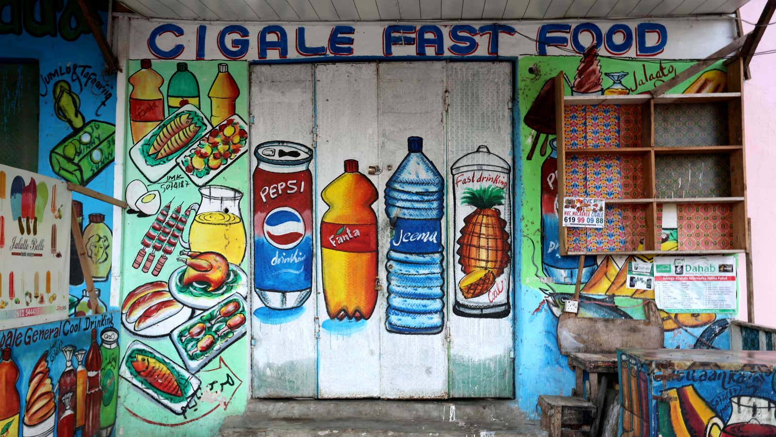 A mural on the wall of a fast food store illustrates food and drinks in Wabari district of Mogadishu, Somalia.