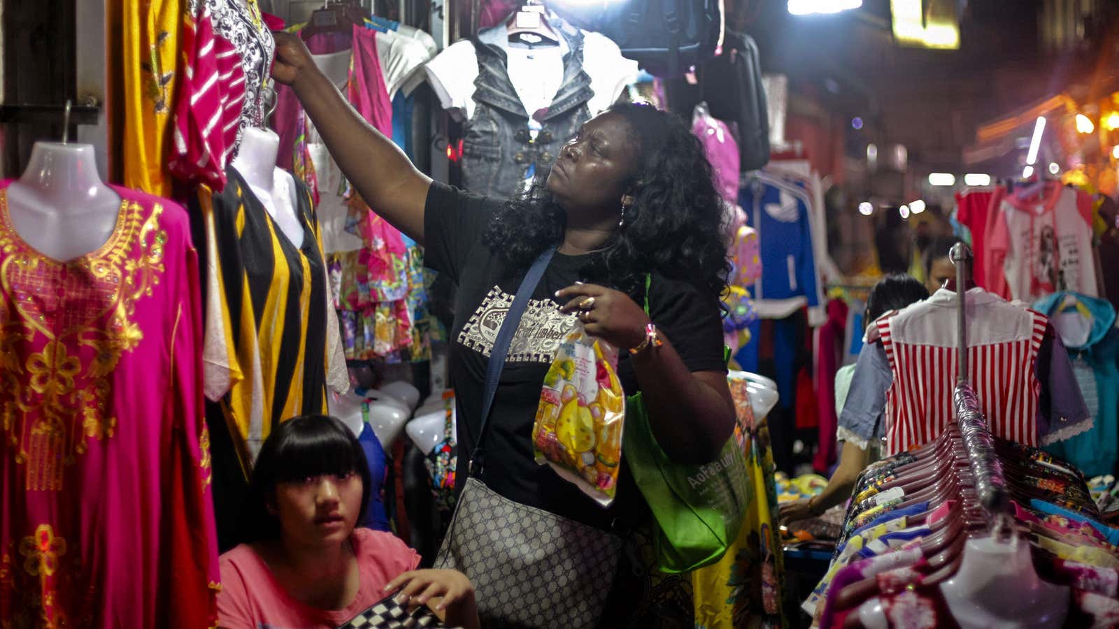 An African woman shops at a market at “African village” in Guangzhou, Guangdong province