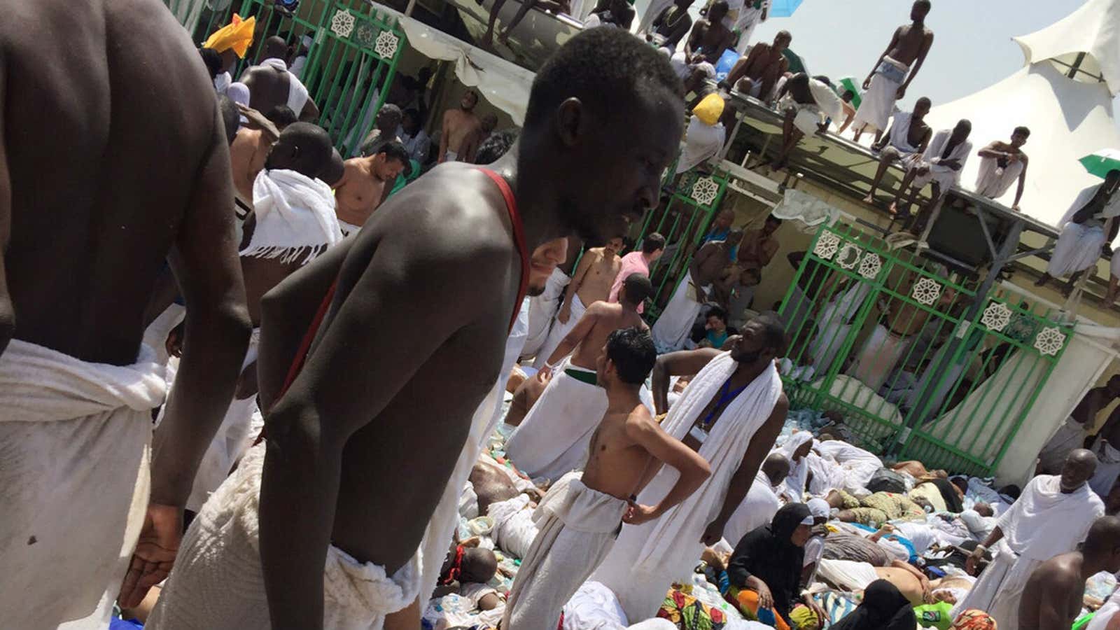 Pilgrims gather around the victims of a stampede in Mina, Saudi Arabia