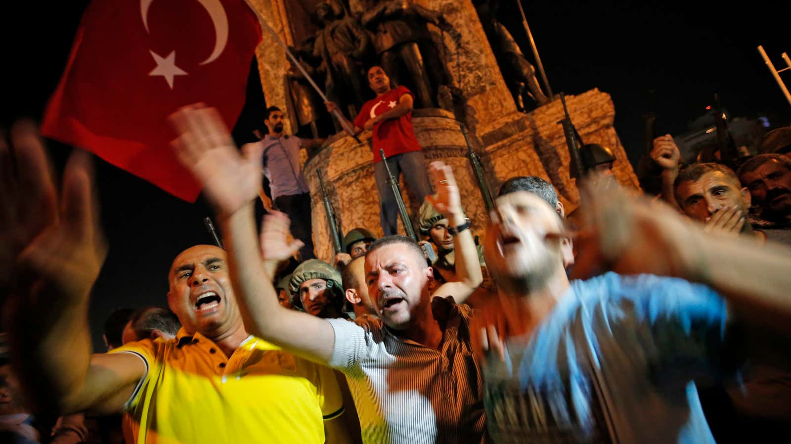 Supporters of Turkey’s President Recep Tayyip Erdogan, protest in front of soldiers in Istanbul’s Taksim square.