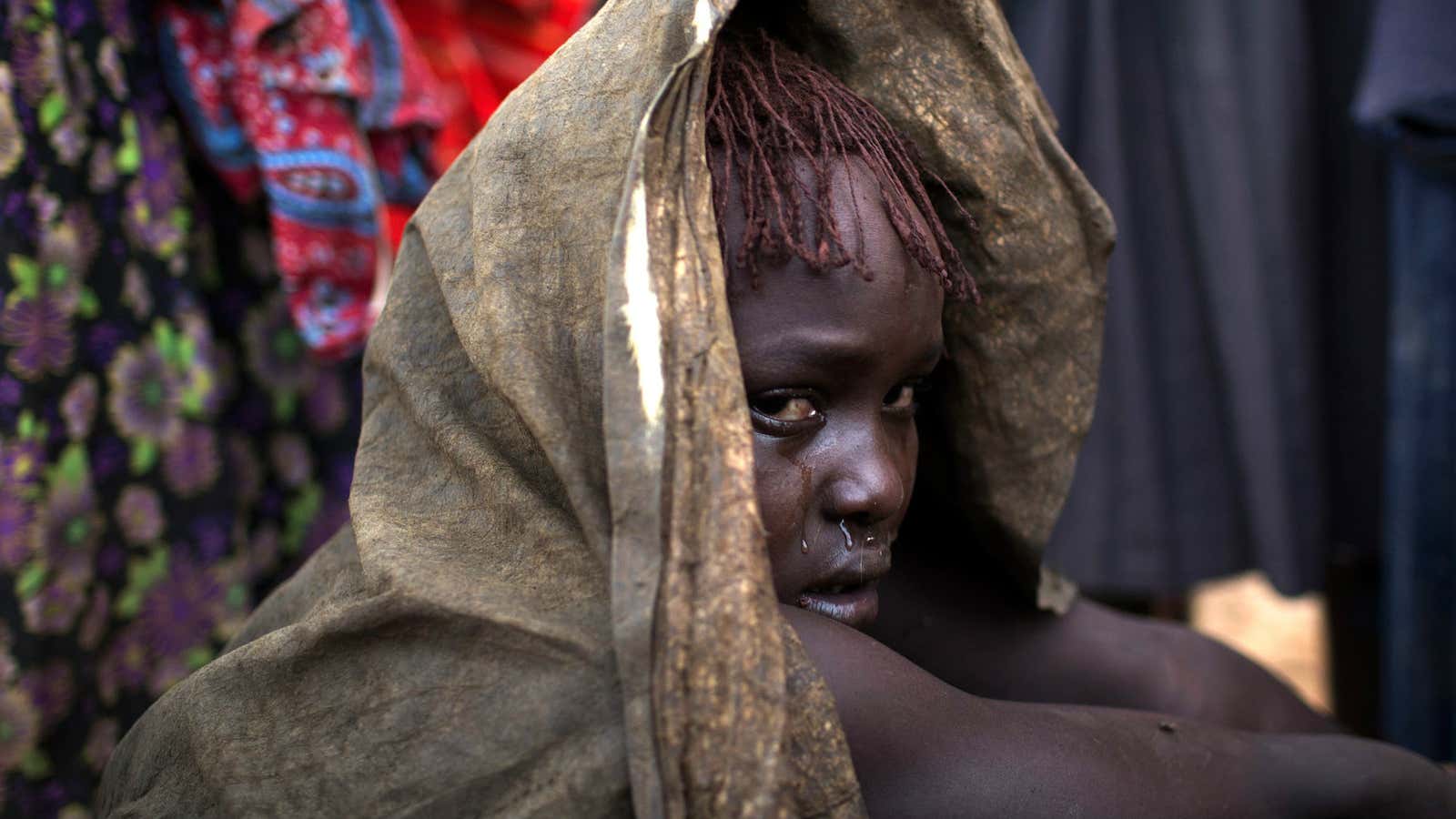 A girl in Baringo County Kenya cries after being circumcised.