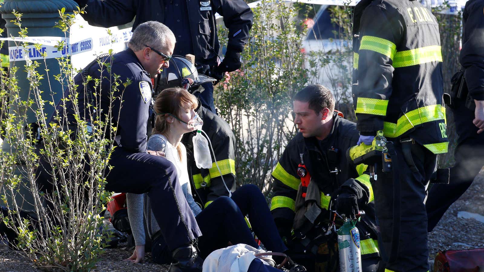An injured woman is aided at the scene in lower Manhattan.