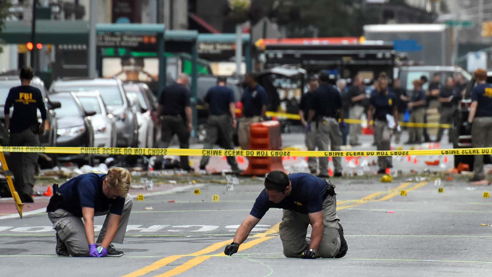 FBI officials inspect the scene of the Chelsea bombing.