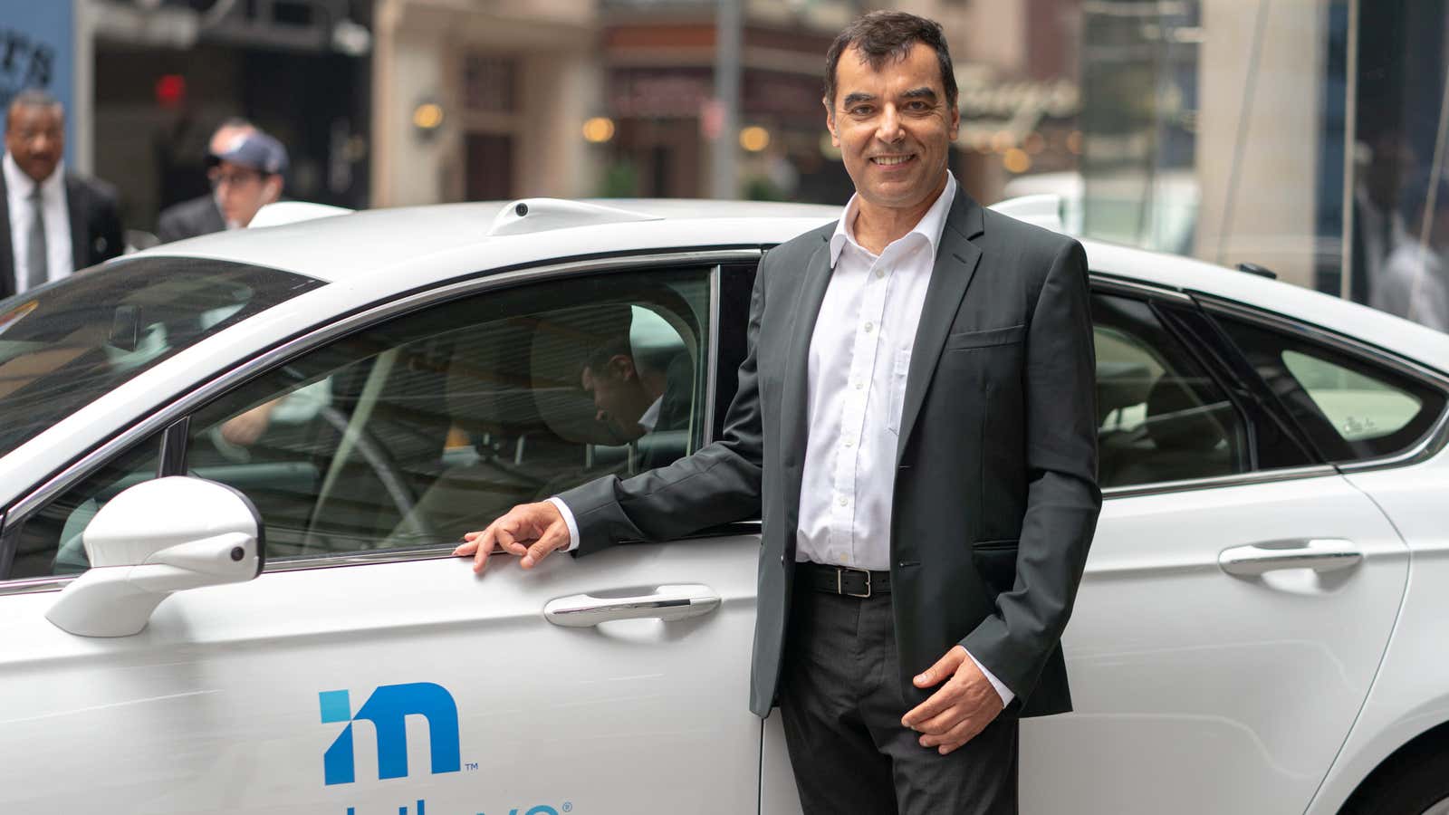 Mobileye’s CEO Amnon Shashua poses with a Mobileye driverless vehicle at the Nasdaq Market site in New York, U.S., July 20, 2021.
