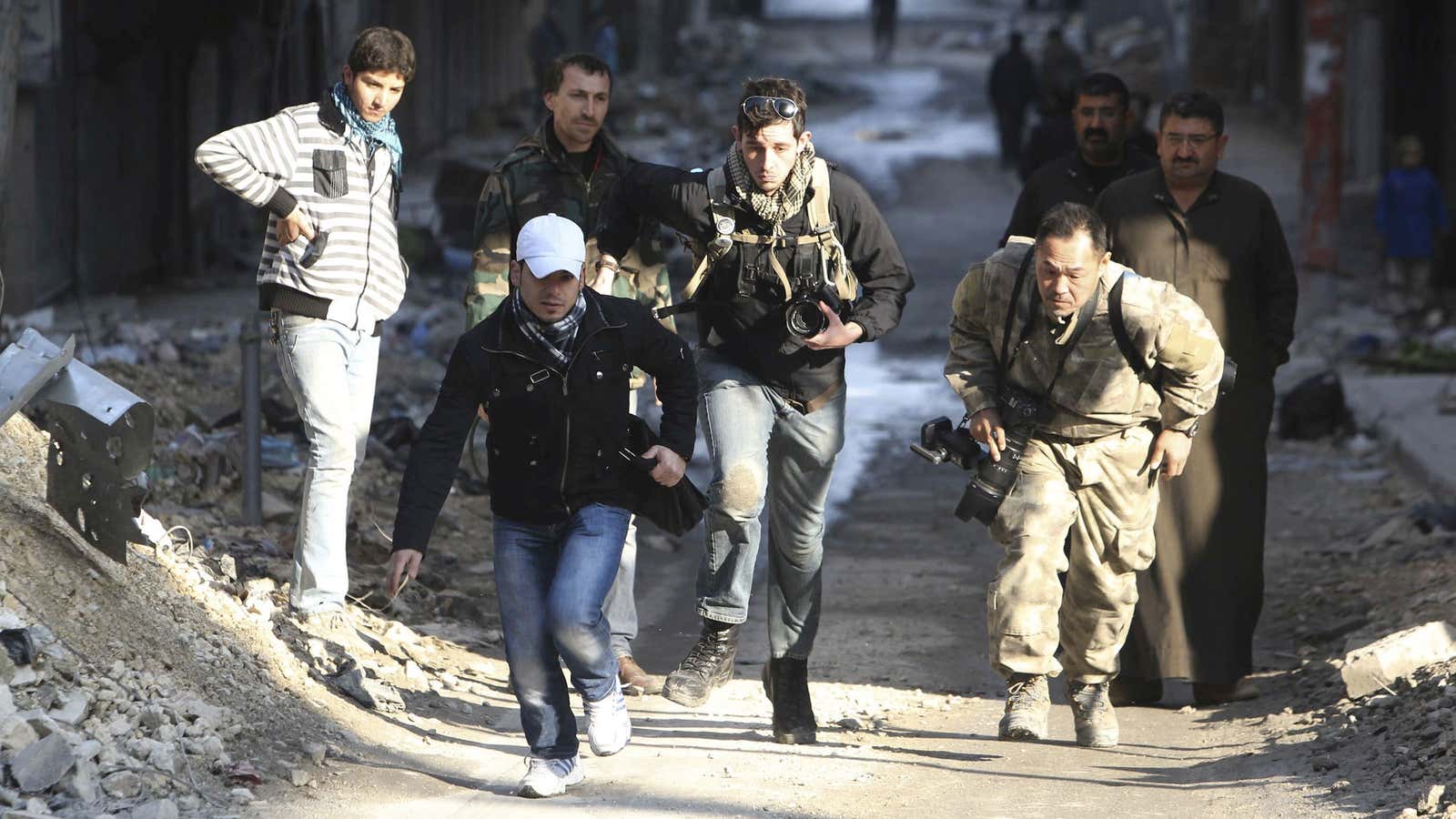 Running for cover in Aleppo.