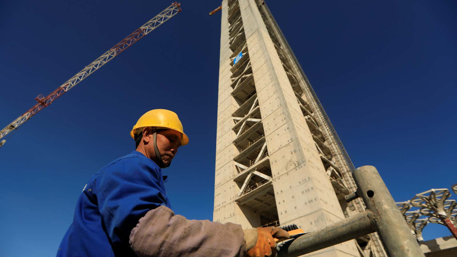 A Chinese worker is seen below the 270-meter-high minaret at the construction site of the new Great Mosque of Algiers, built by the China State Construction Engineering Corporation (CSCEC) in Algiers, Algeria. Feb. 7 2017