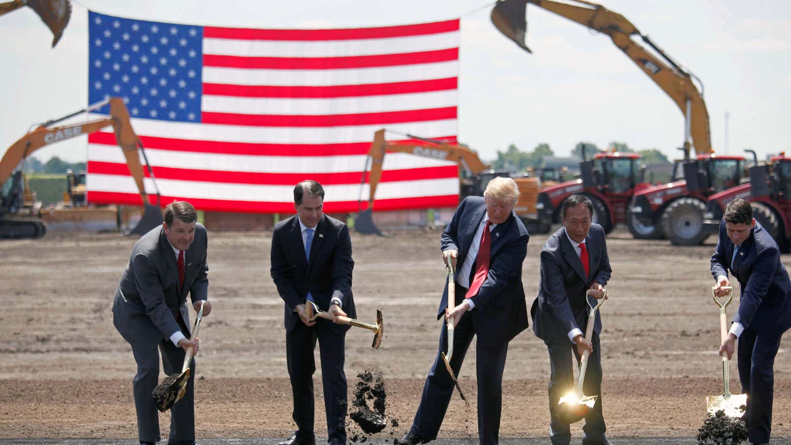Breaking ground with a golden shovel.