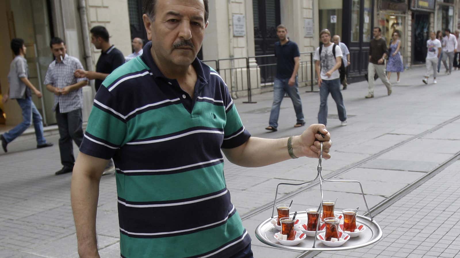 If only Turkey could balance its capital flows as ably as this vendor and his tray of tea.