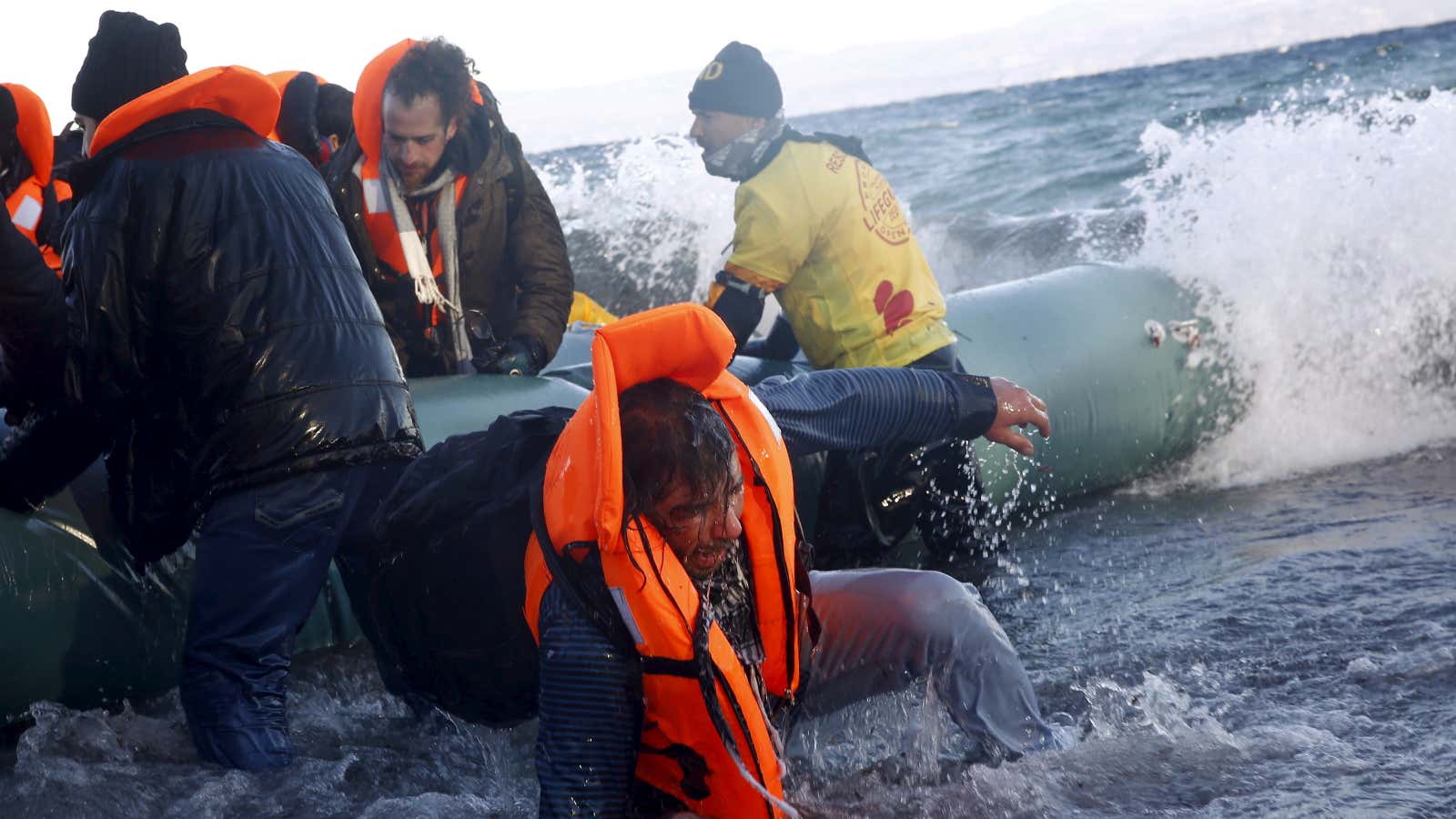 Syrian and Iraqi refugees arrive on a raft in Greece on Jan. 1, 2016.