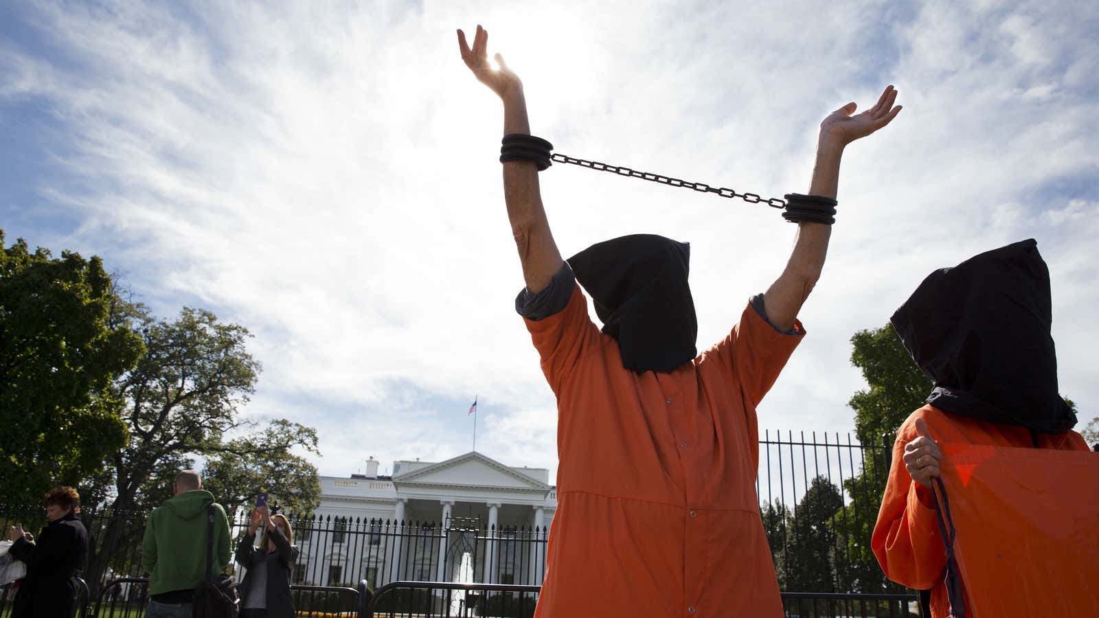 People protest against “indefinite detentions” at Guantanamo Bay detention center outside of the White House in Washington, DC, in Oct. 2014.