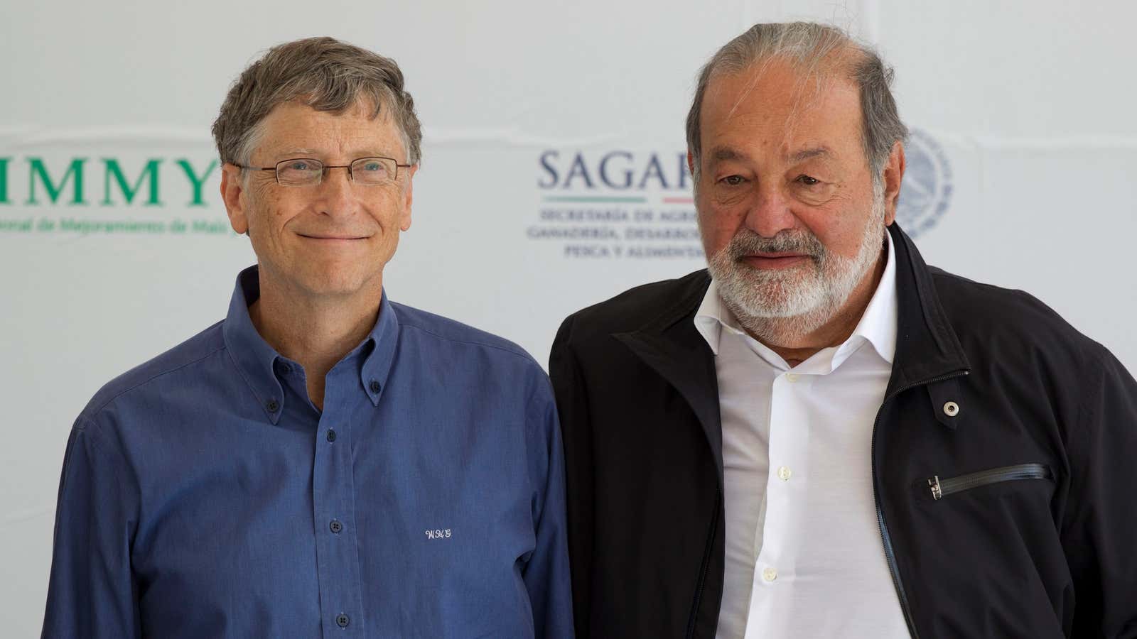 The world’s two richest men. Carols Slim, on the right, is still number one, though he just lost $4 billion.