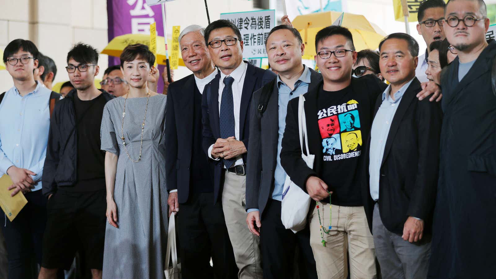 From left, pro-democracy activists Cheung Sau-yin, Chung Yiu-wa, Tanya Chan, Chu Yiu-ming, Chan Kin-man, Benny Tai, Raphael Wong, Lee Wing-tat, and Shiu Ka-chun, at the court.