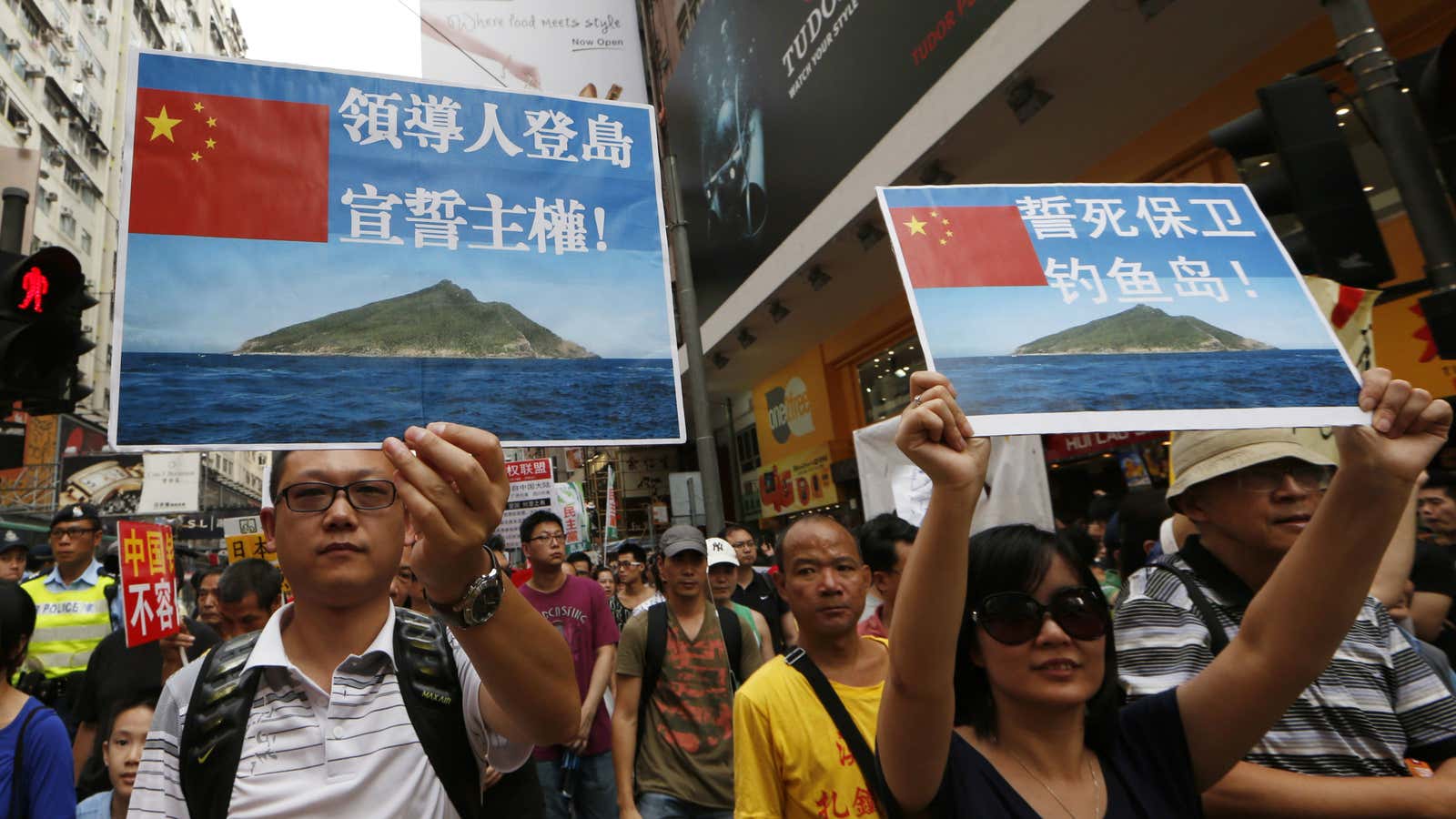 In Hong Kong, anti-Japanese protestors hld signs of disputed islands in South China Seas.