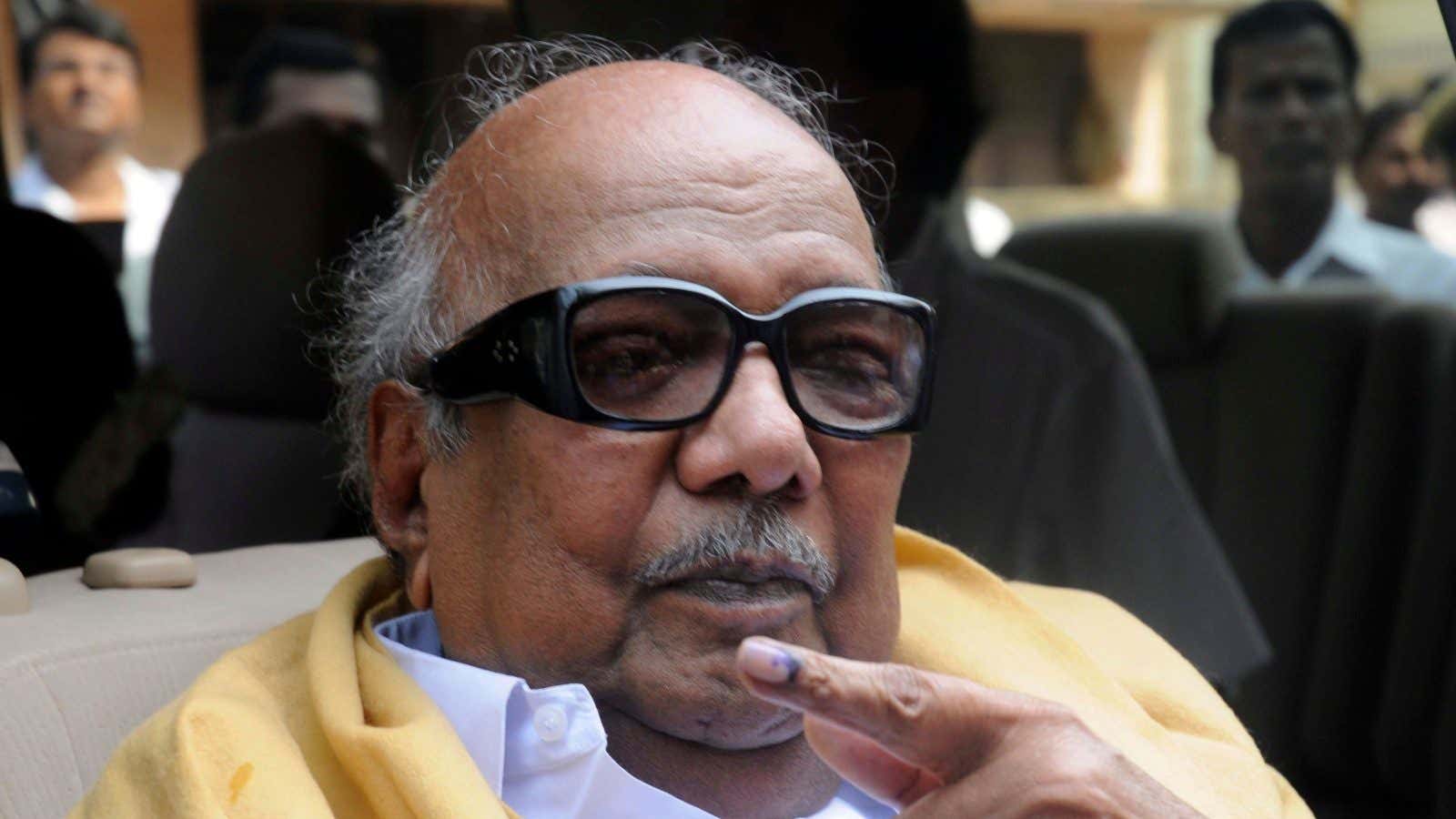 Tamil Nadu state Chief Minister M. Karunanidhi displays the indelible ink mark on his finger after casting his vote at a polling booth in Chennai,…