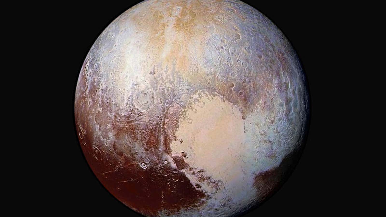 Beneath Pluto’s heart, a vast ocean.