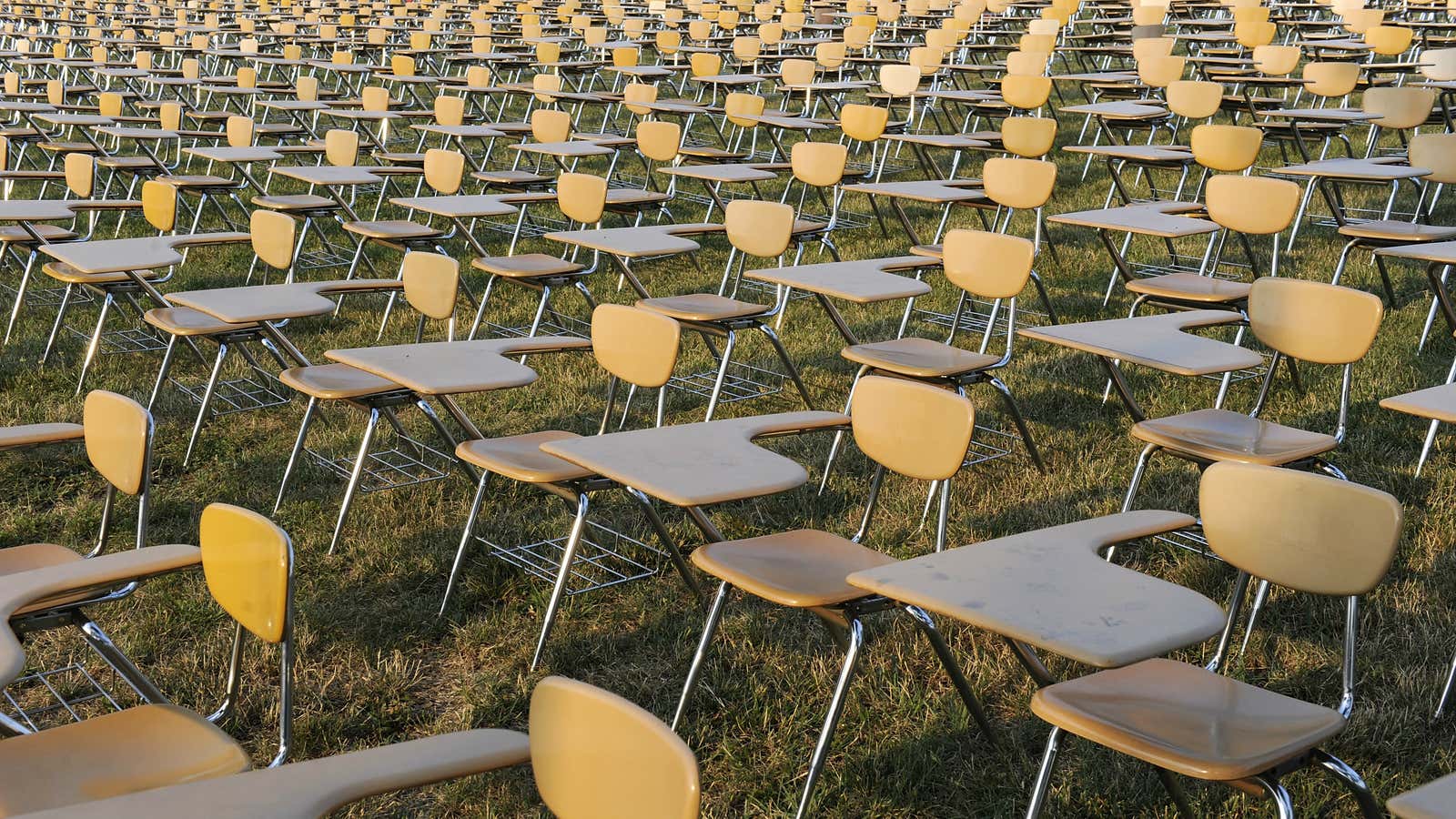 An art installation of 857 empty school desks representing drop-outs