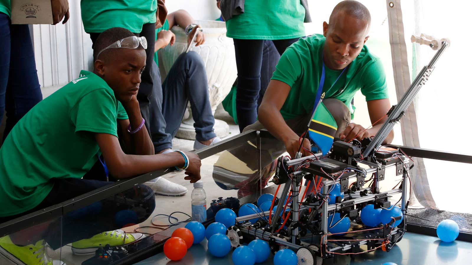 Godbright Nixon Uiso, 16, left, and Raymond Benedict, 18, with Team Tanzania, practice working their robot at the FIRST Global Robotics Challenge, Monday, July 17,…