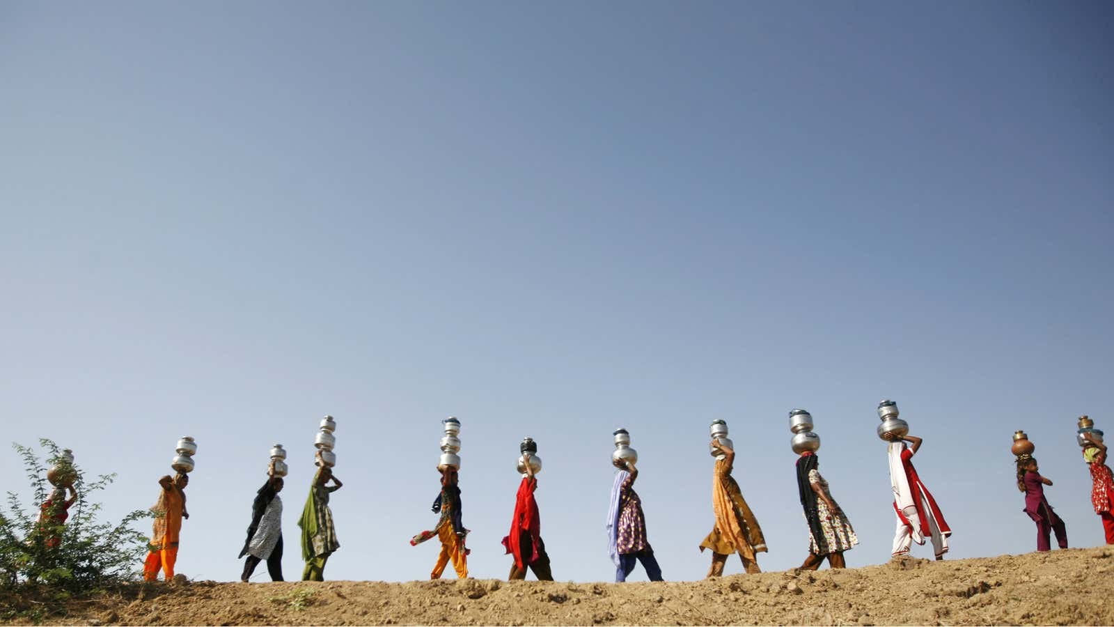 Women carry water in Meni village, Gujarat.