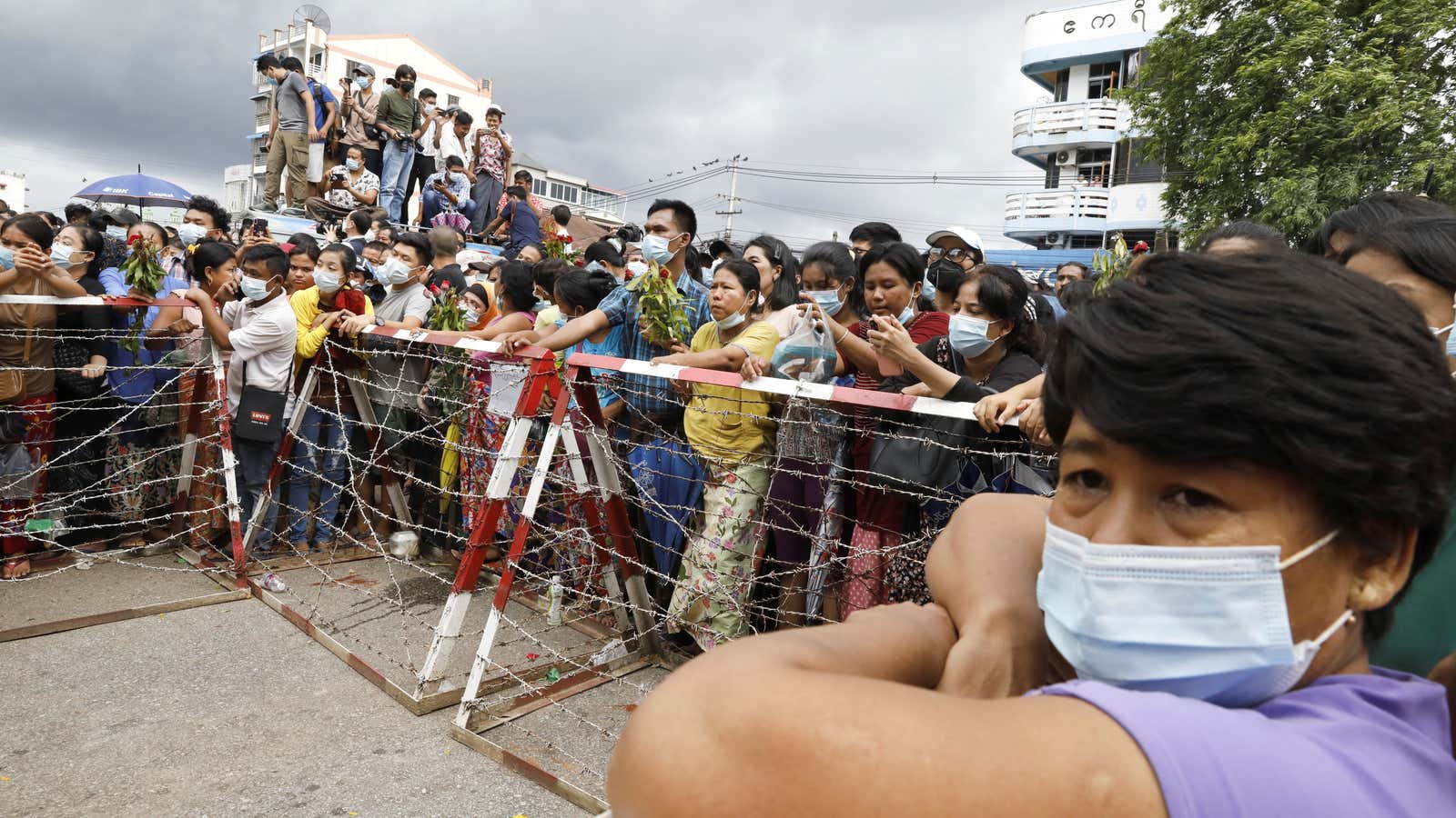 Families wait outside Insein prison in Yangon.