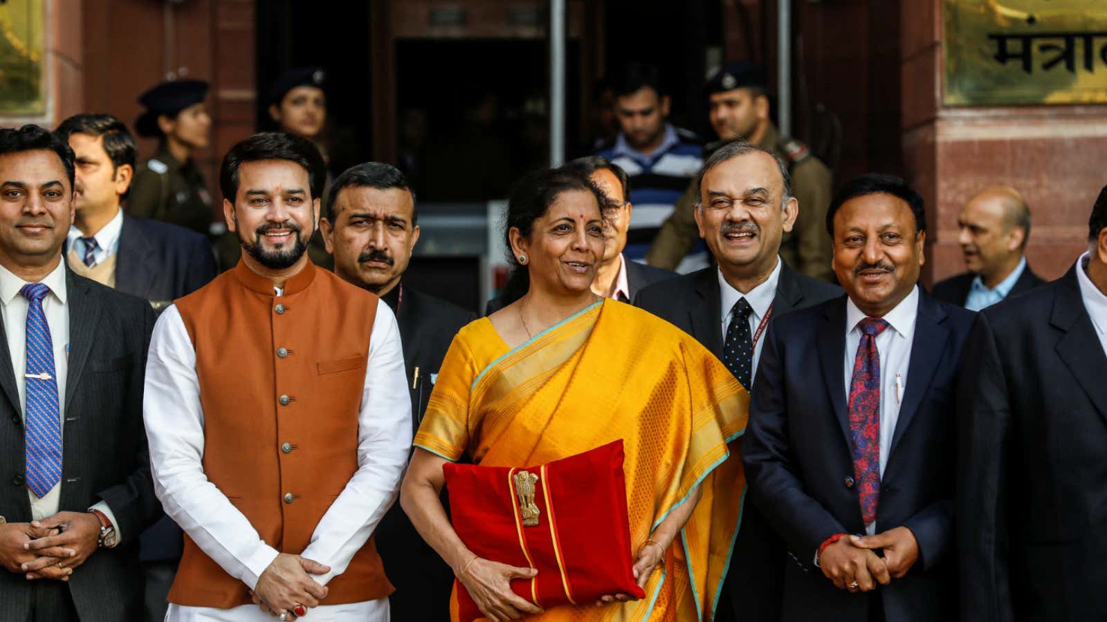 India’s Finance Minister Nirmala Sitharaman holds budget papers during a photo opportunity as she leaves her office to present the federal budget in the parliament…