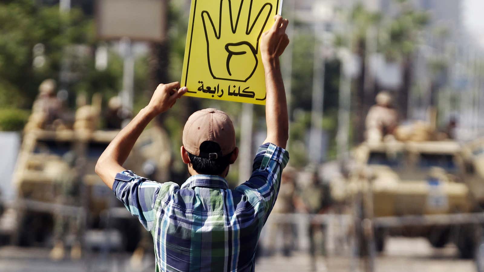 A supporter of ousted Egyptian President Mohamed Morsi protests against the military and interior ministry in Cairo.