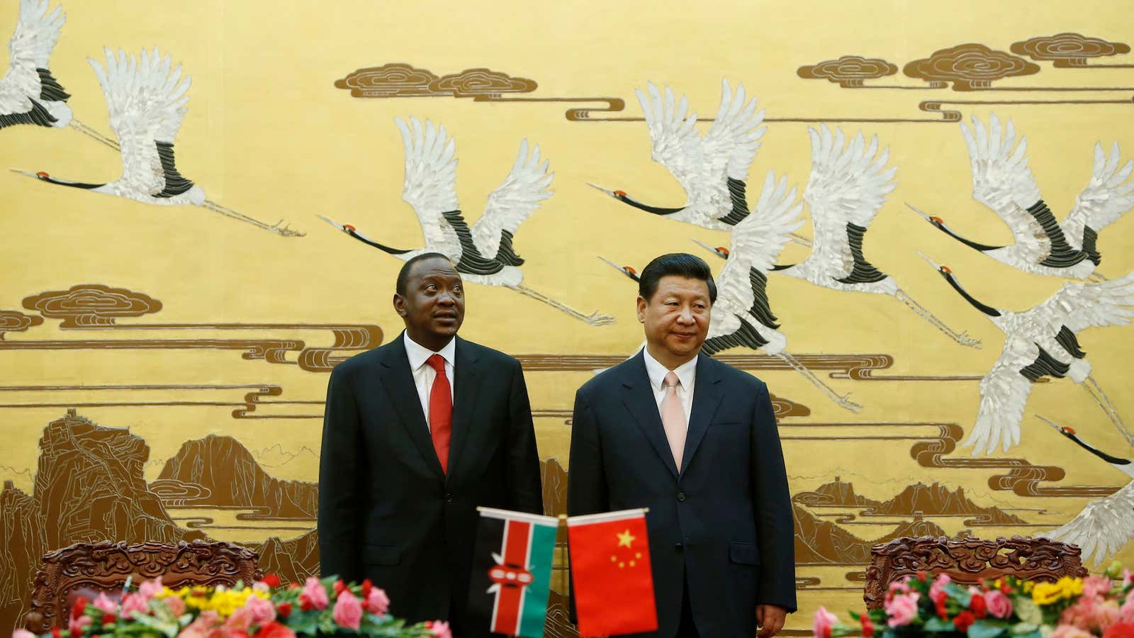Kenyan President Uhuru Kenyatta (L ) and his Chinese counterpart Xi Jinping stand together during a signing ceremony at the Great Hall of the People in Beijing in 2013.