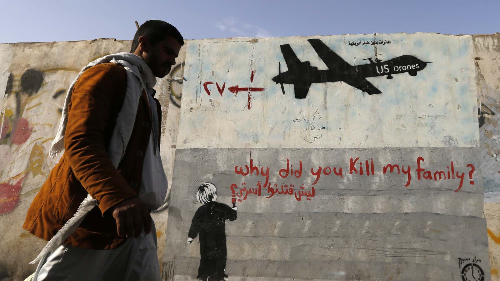 Graffiti denouncing strikes by U.S. drones in Yemen, painted on a wall in Sanaa.