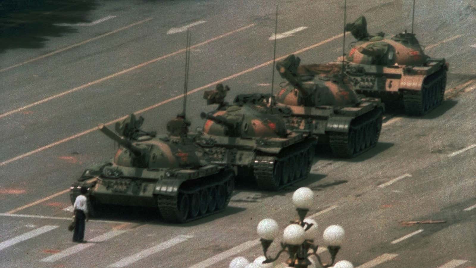 A Chinese man blocks military tanks on Changan Avenue, near Tiananmen Square in Beijing, June 5 1989.