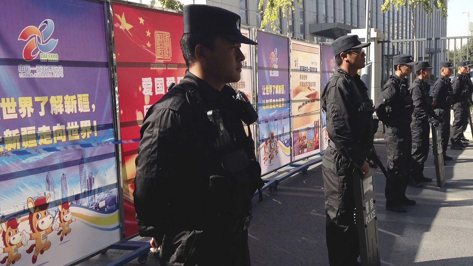 Policemen in riot gear in Urumqi in 2014, during the trial of Ilham Tohti.