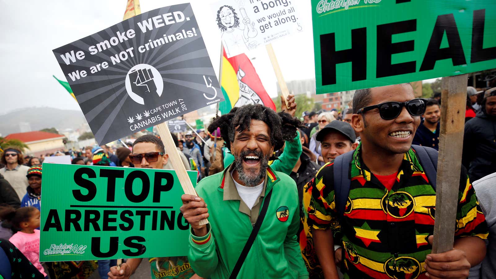 Demonstrators hold placards during a 2017 march calling for the legalization of cannabis in South Africa.