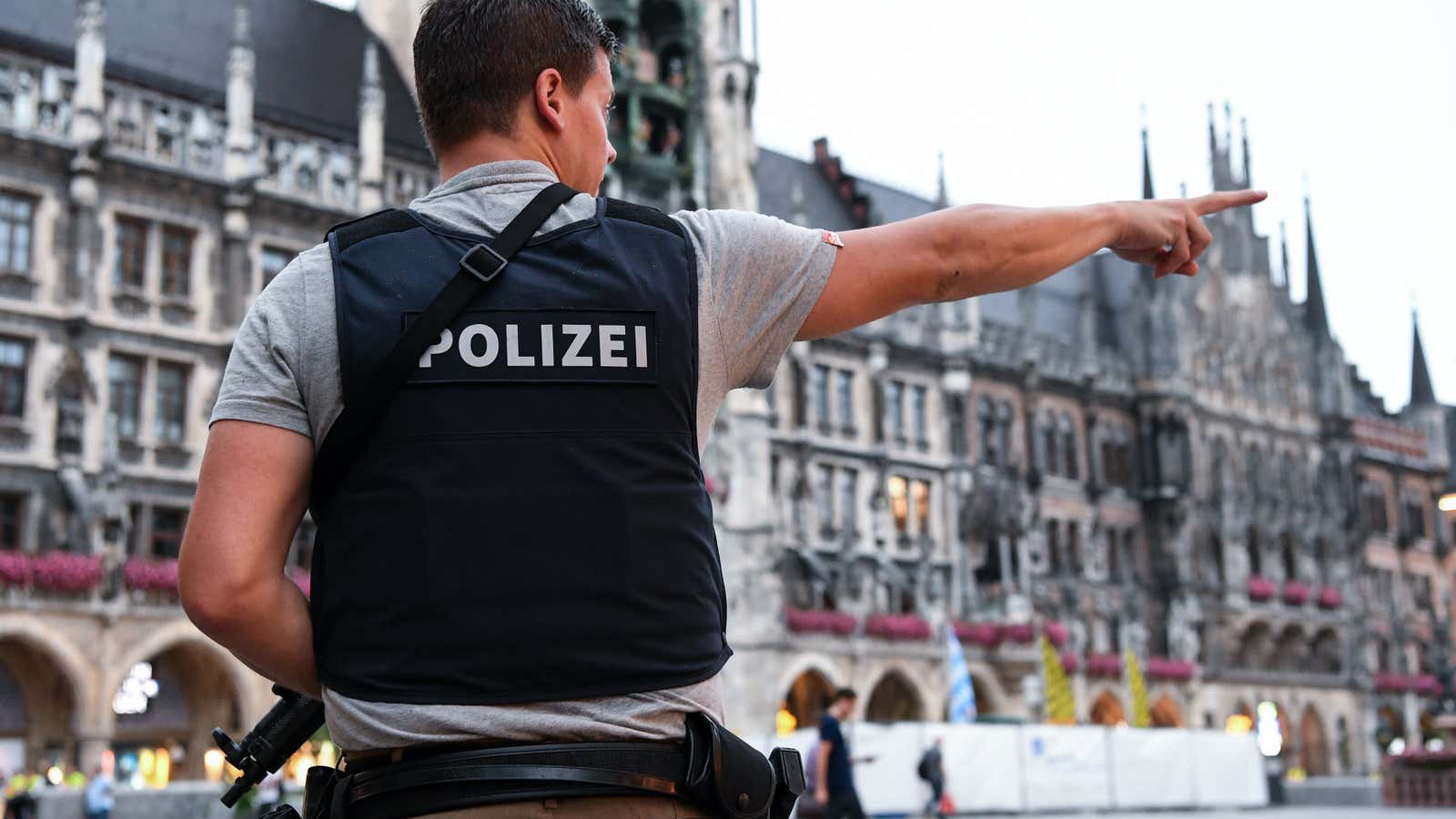 A Munich policeman secures an area of the city after a shooting spree on July 22.