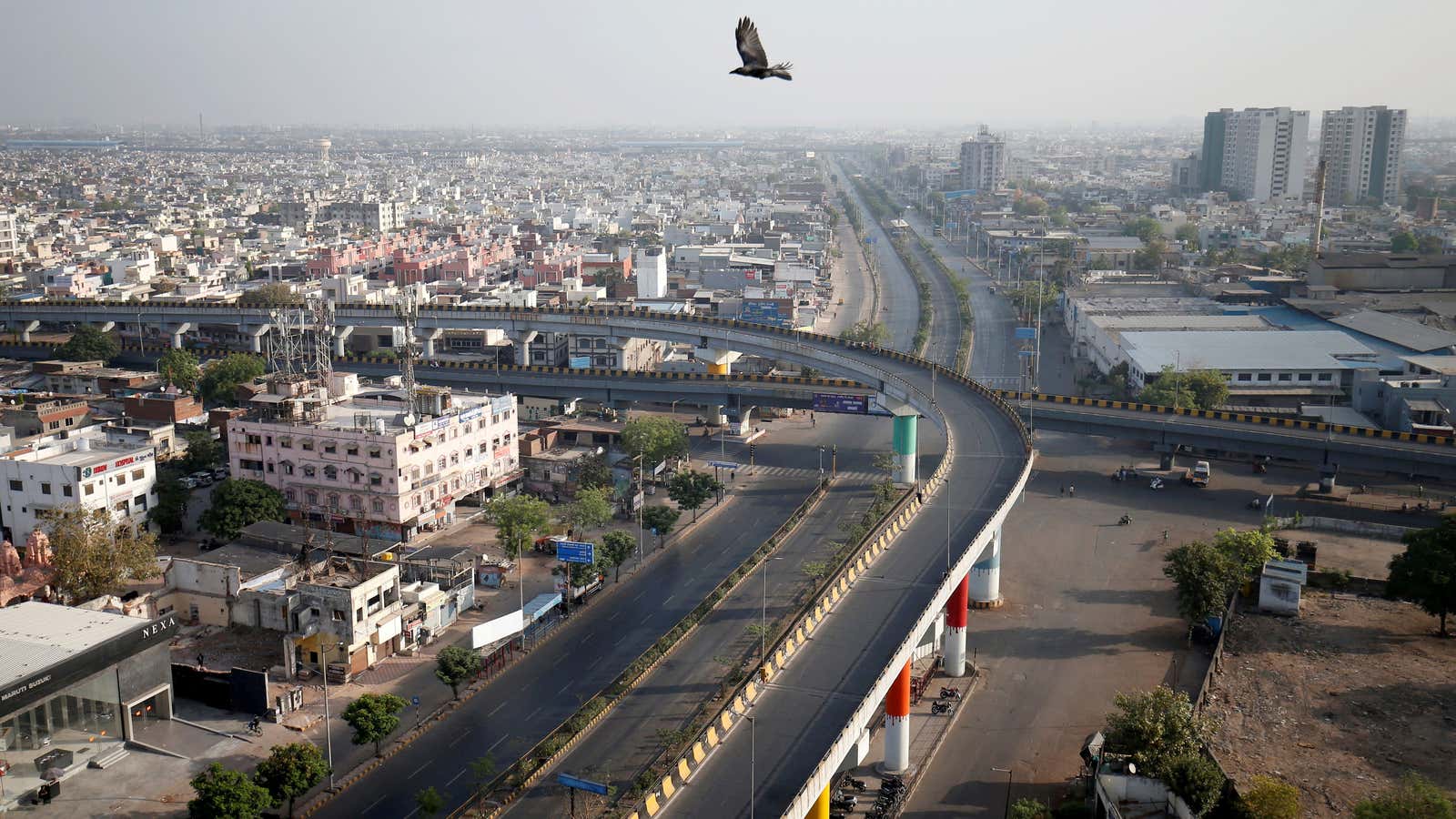 FILE PHOTO: A view shows empty roads during a 14-hour long curfew to limit the spreading of coronavirus disease (COVID-19) in the country, in Ahmedabad,…