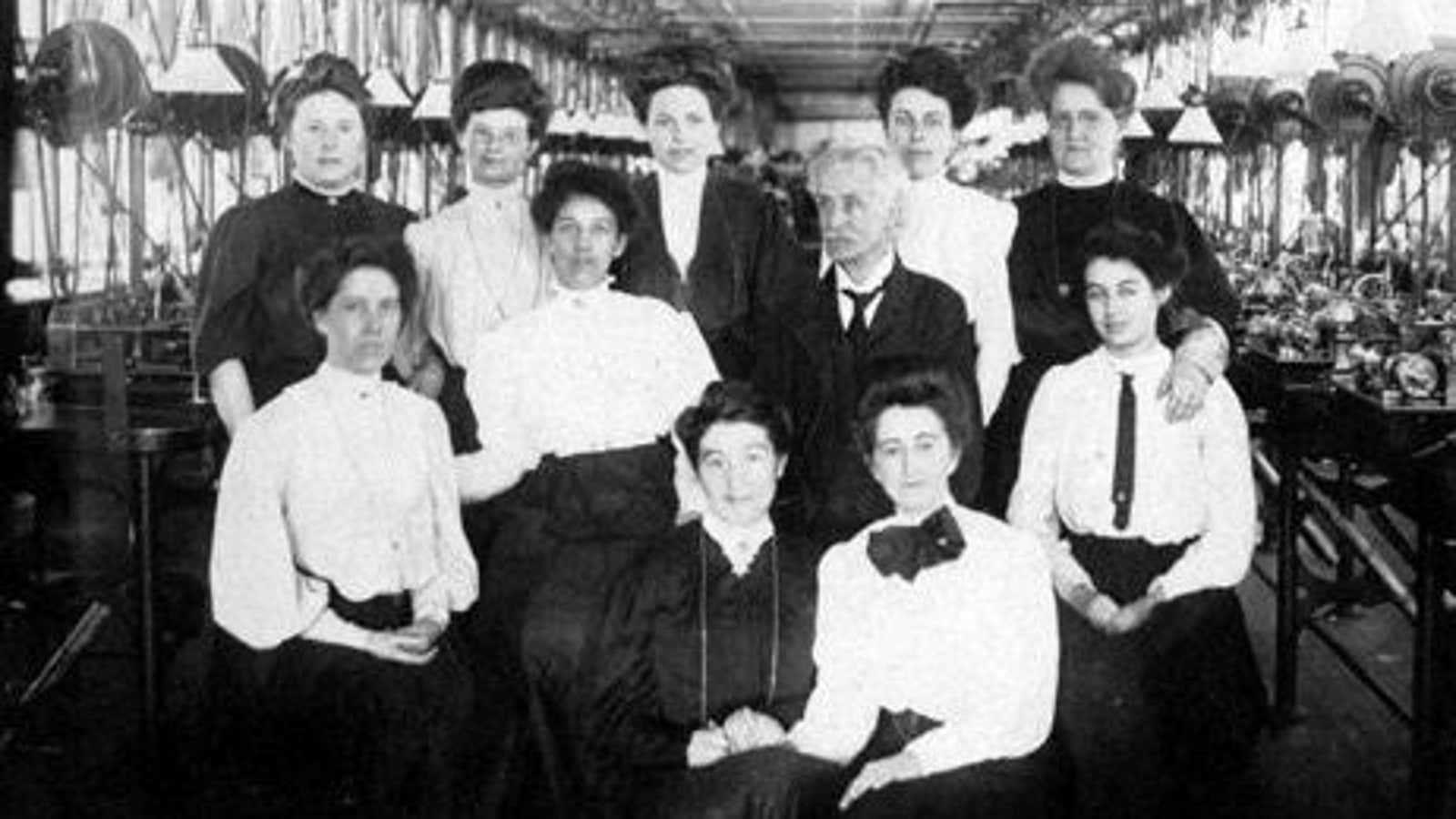 Early Waltham women workers with a senior Waltham employee.