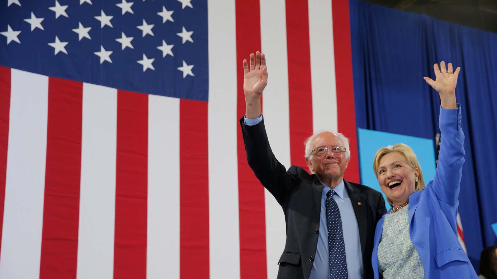 Democratic candidates Hillary Clinton (right), the presumptive nominee, and Bernie Sanders (left).