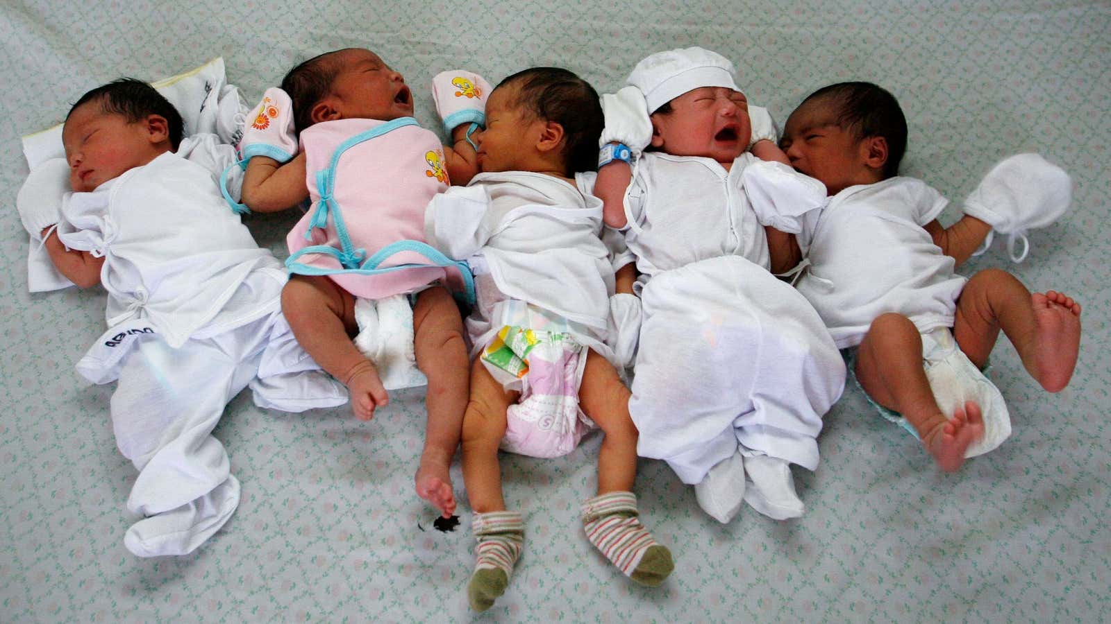 Babies are lined up on a mattress for a routine check-up at a maternity ward in a hospital in Manila July 11, 2010. July 11…