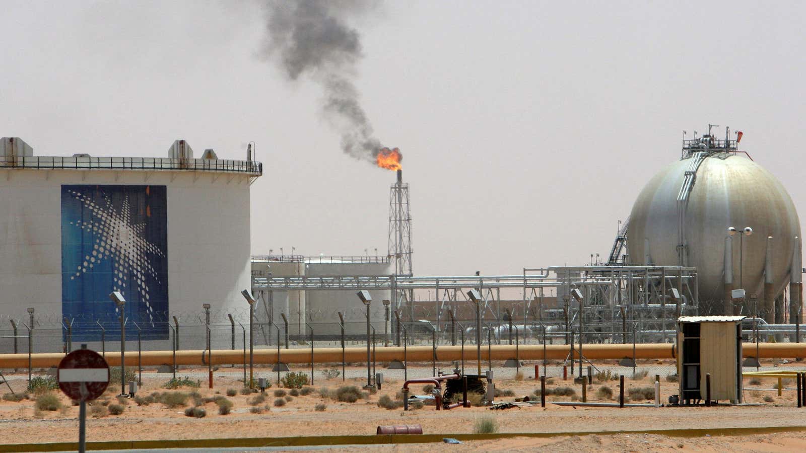 A gas flame is seen in the desert near the Khurais oilfield, Saudi Arabia.