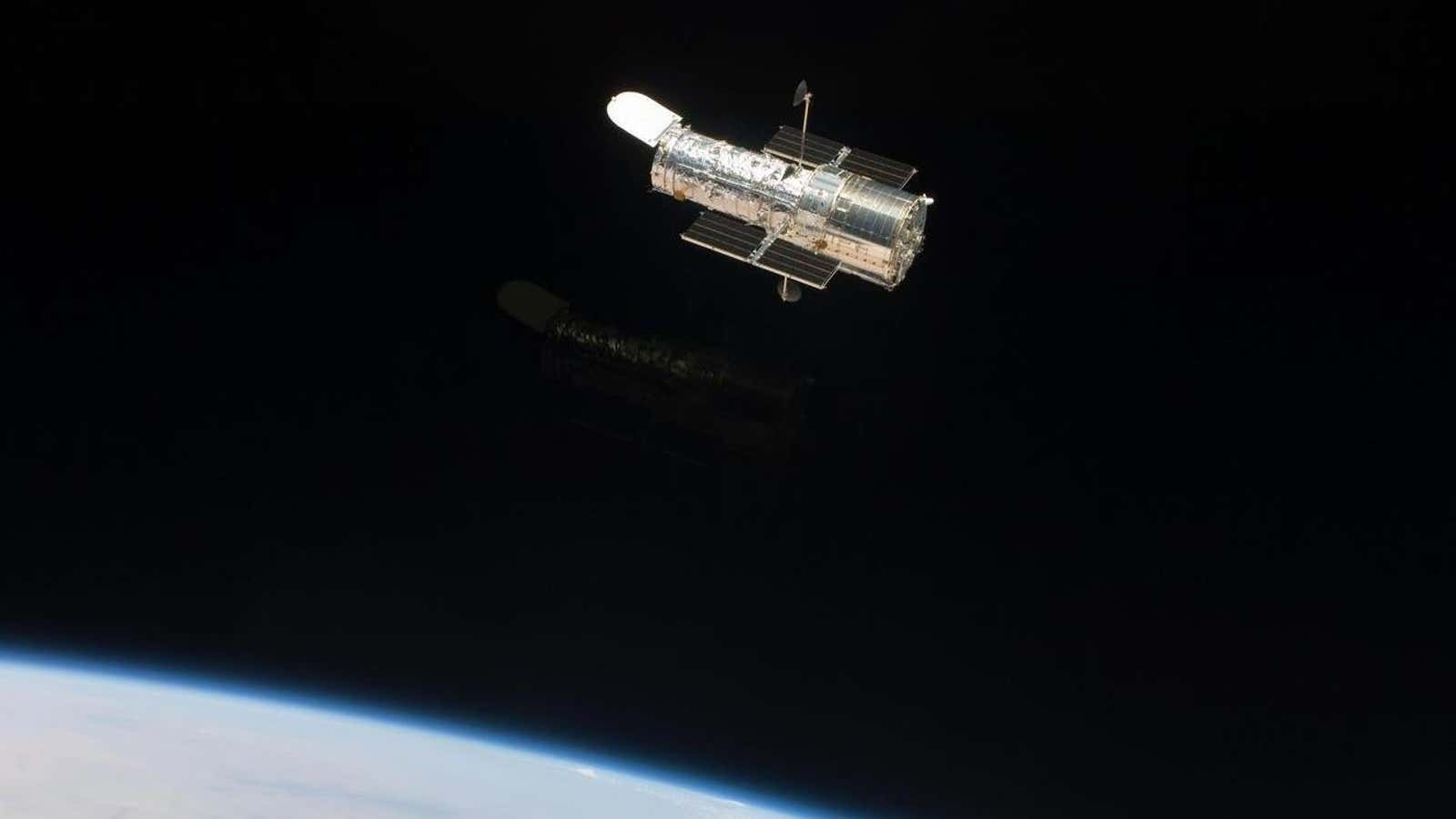 The Hubble Space Telescope in orbit over the Earth.