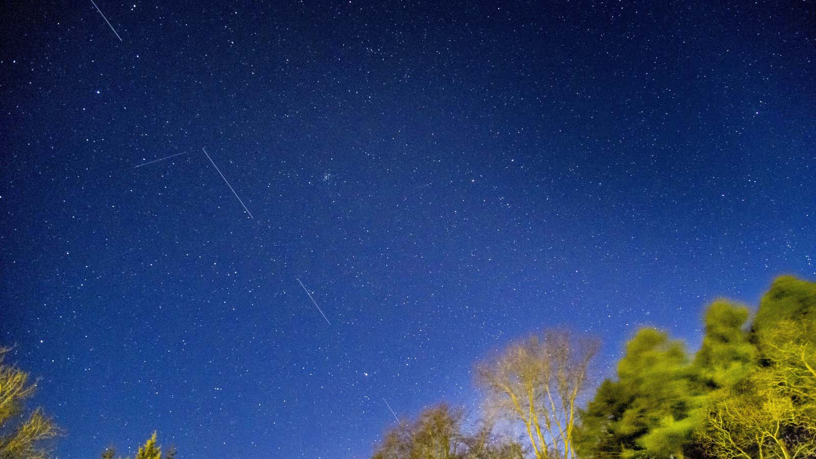 A long exposure shows Starlink satellites flying overhead in April 2020.
